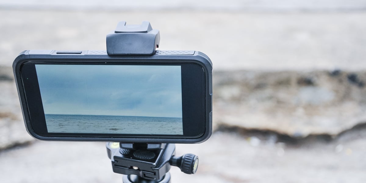 A smartphone mounted on a tripod recording video, capturing organised evidence for a Proof Guard record